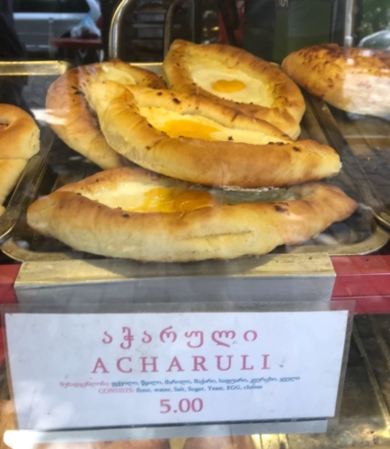 Acharuli - The famous cheese filled bread "boat" with an egg and butter 